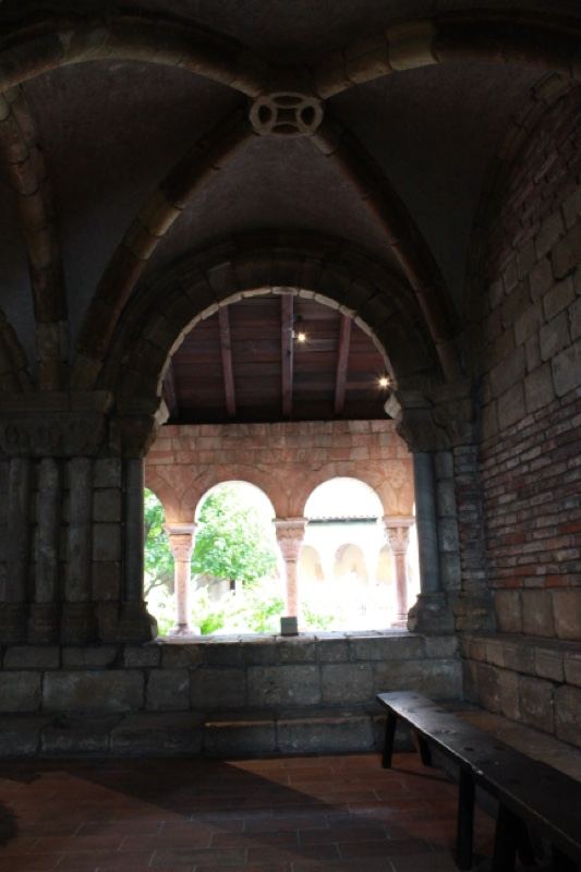 Interior arched cloister with bench