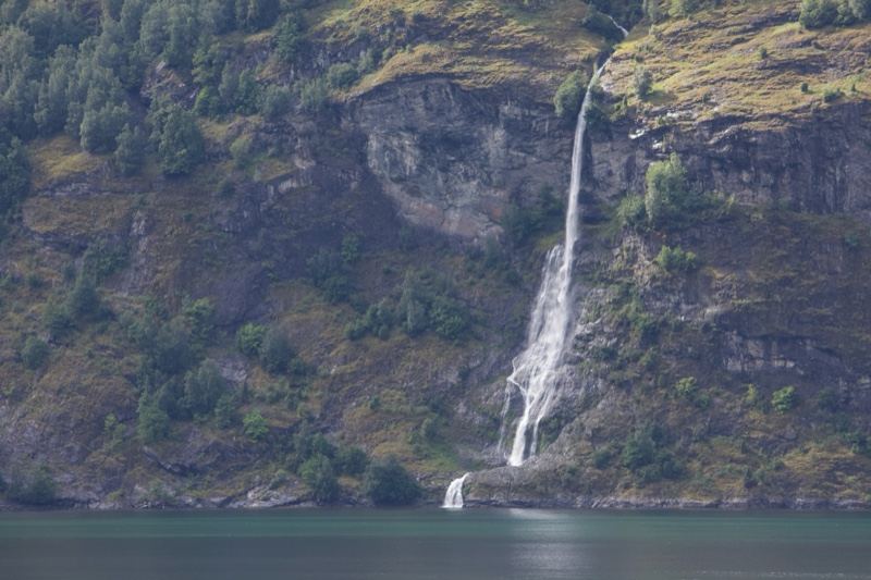 Waterfall Cascading Into Fjord