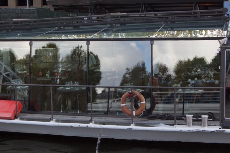 Glass houseboat waterfront reflection