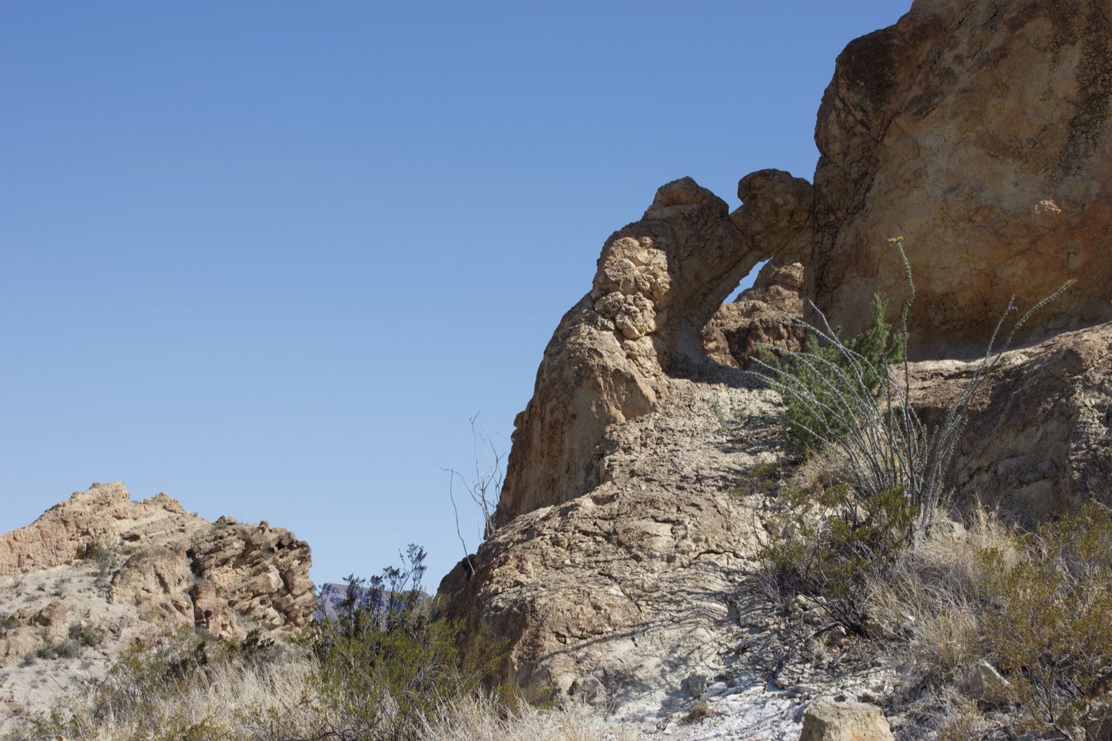Desert Rock Arch Under Clear Blue Sky