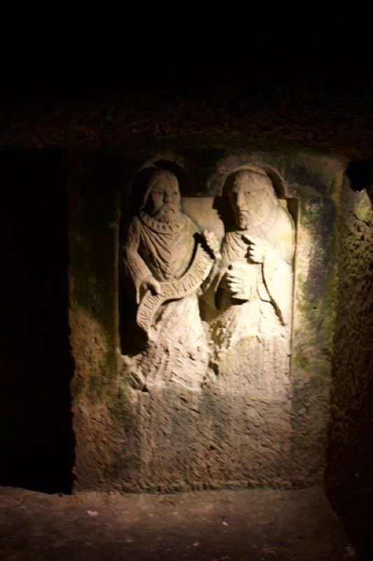 Illuminated Stone Relief of Two Figures