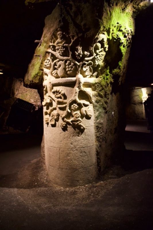 Carved Stone Pillar In Dark Cave