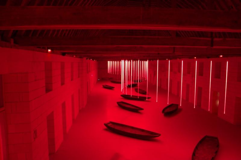 Red Lit Hall With Boats Installation