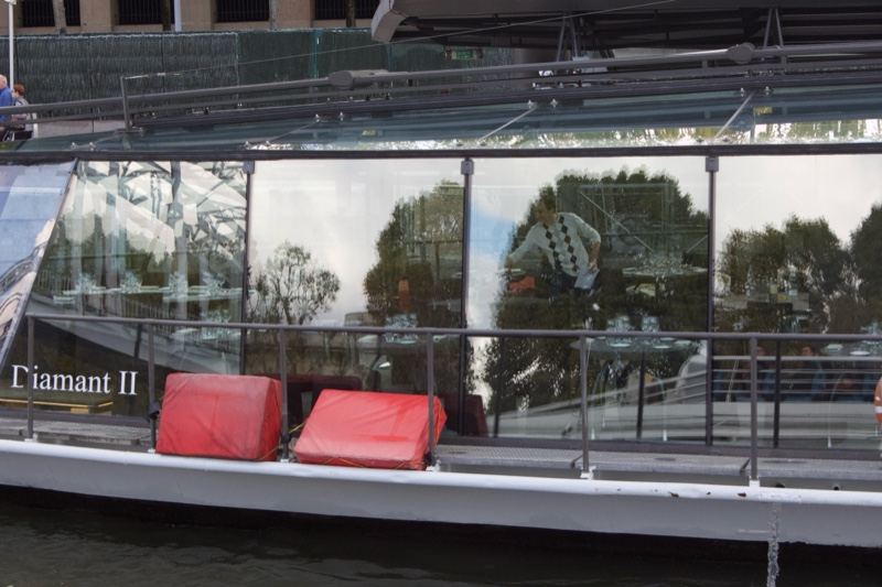 Boat deck with red cushions reflection