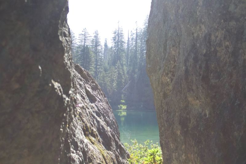 Rock Formation Framing Forest Lake