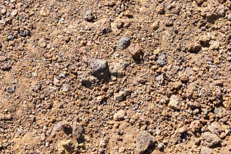 Dry rocky soil texture close-up