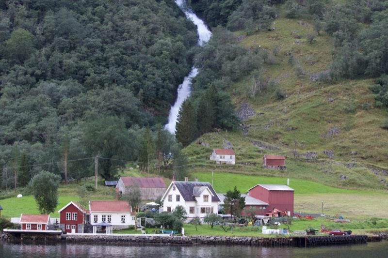 Norwegian Fjord Village With Waterfall
