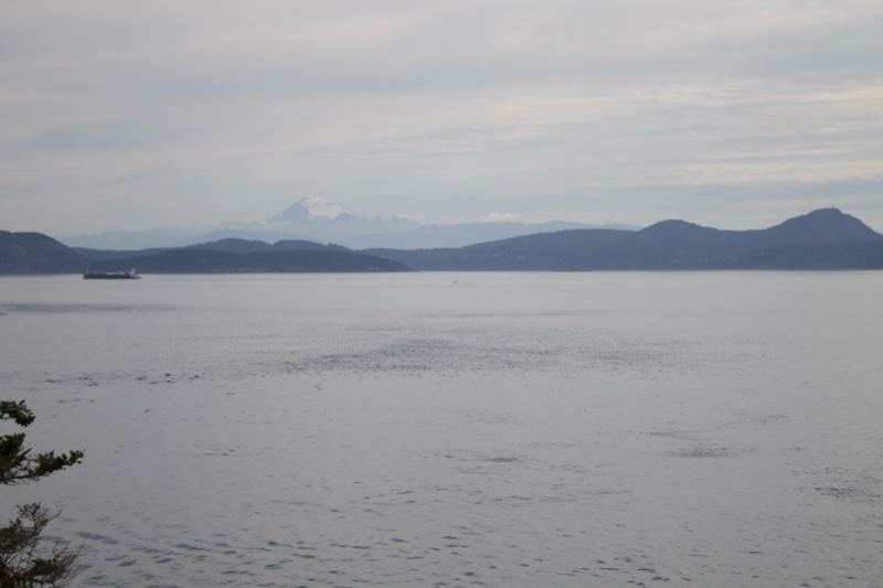 Overcast Bay With Distant Mountains
