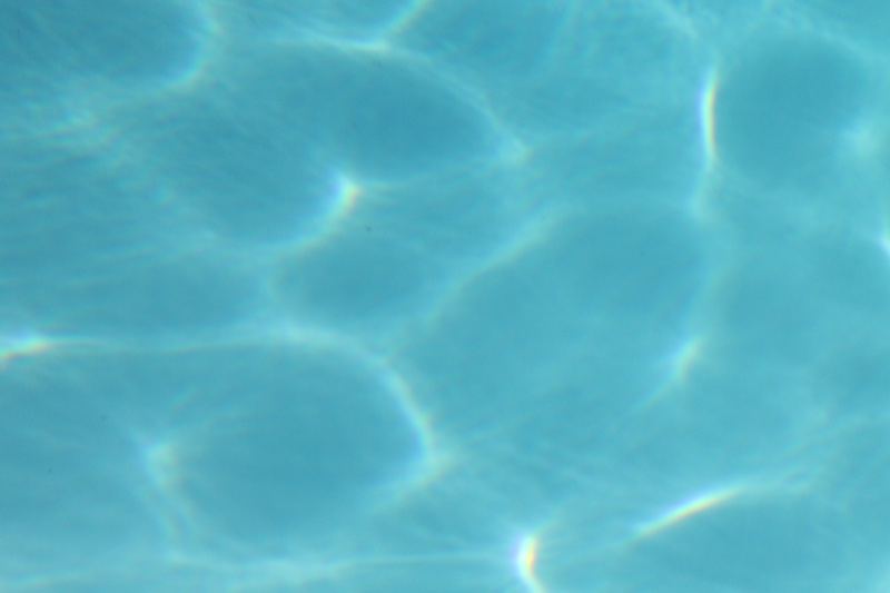 Sunlit Pool Water Surface Ripples