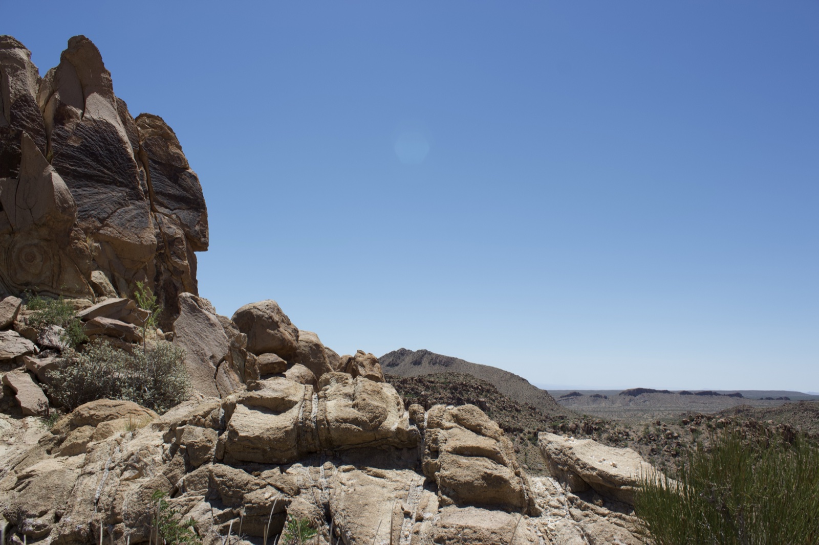 Arid Rocky Desert Landscape Under Clear Sky