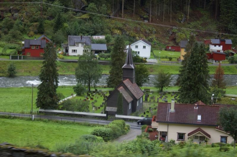 Rural Village Church By River Valley