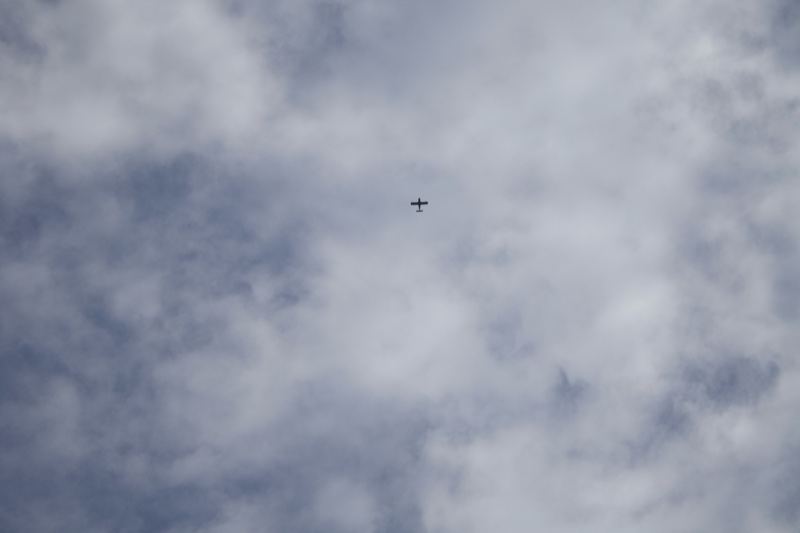 Airplane Flying Above Cloudy Sky