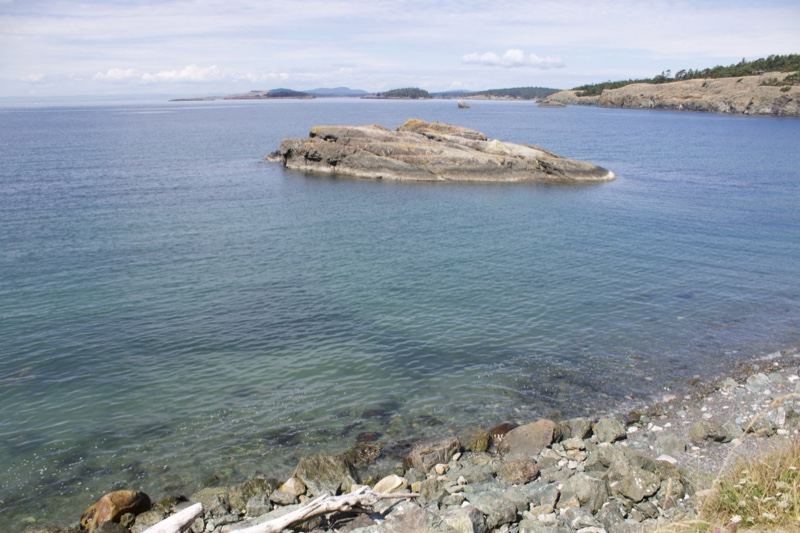 Rocky Islet in Calm Coastal Waters