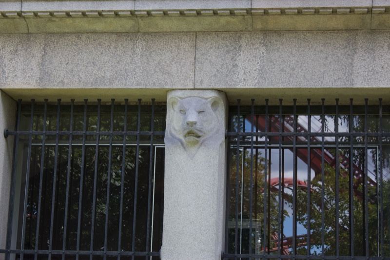 Lion Head Stone Pillar Between Barred Windows