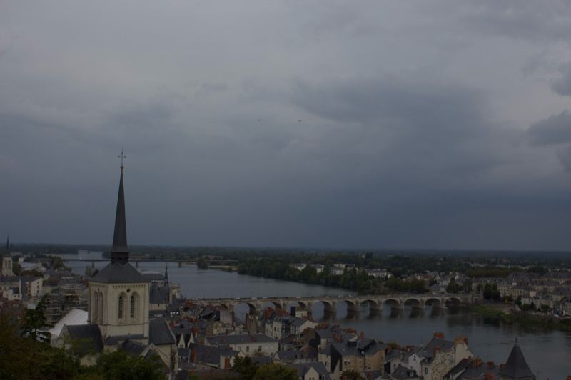 Overcast View of River Town with Church Spire