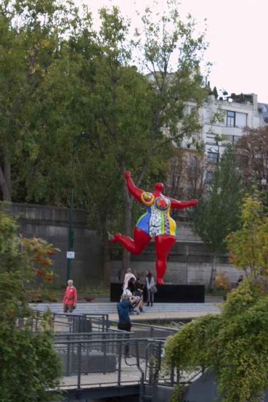 Red Harlequin Sculpture in Park