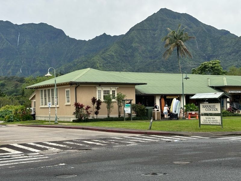 Single-story building with mountain backdrop