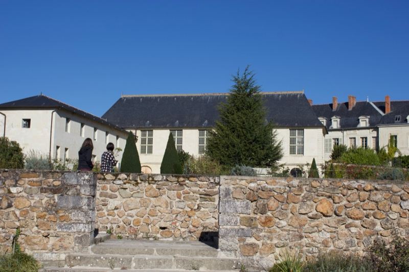 White Manor Behind Stone Wall