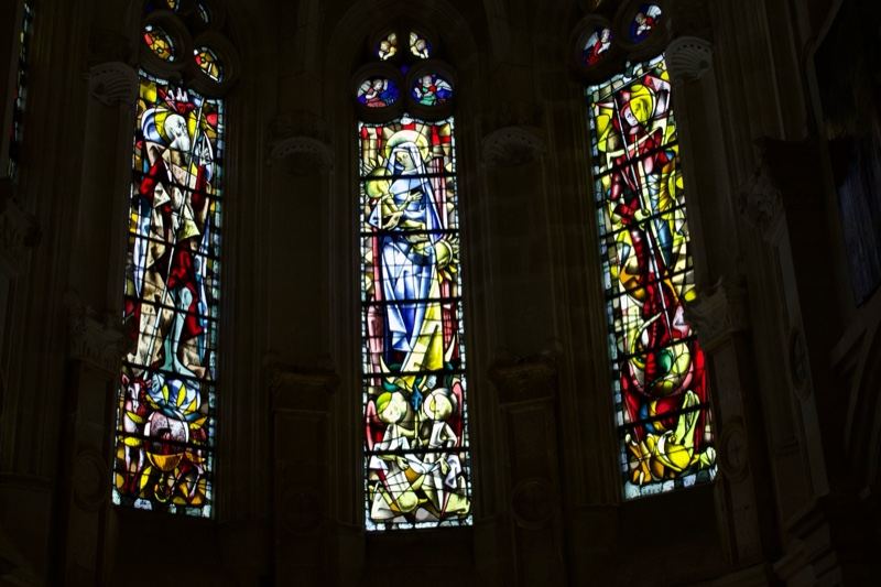 Stained Glass Windows in Dark Church Interior