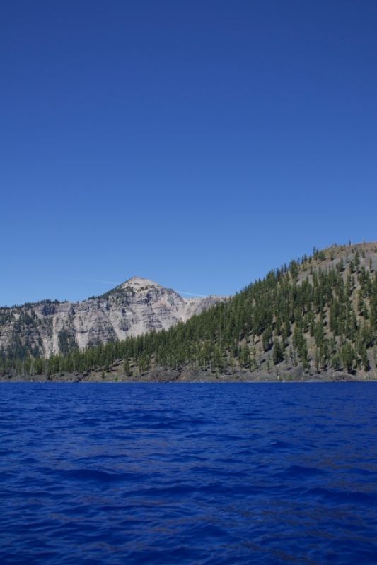 Deep Blue Lake with Forested Hills