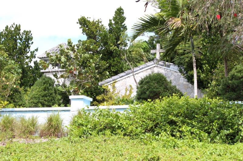 White chapel amid tropical foliage