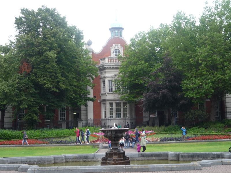 Historic building with fountain and trees
