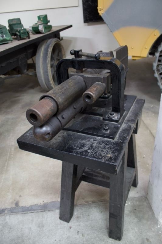 Vintage metal pipe bender on stand