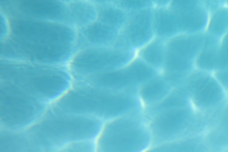 Sunlit Pool Water Surface Ripples