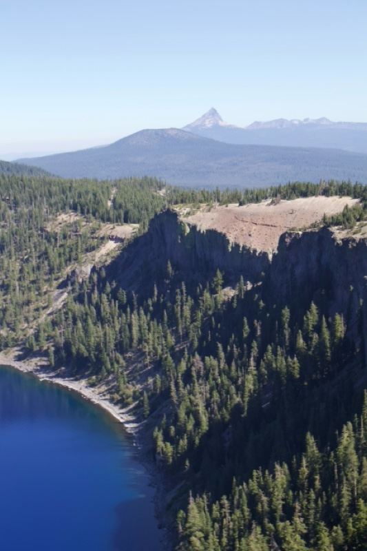 Mountain Lake Overlook With Forested Cliffs