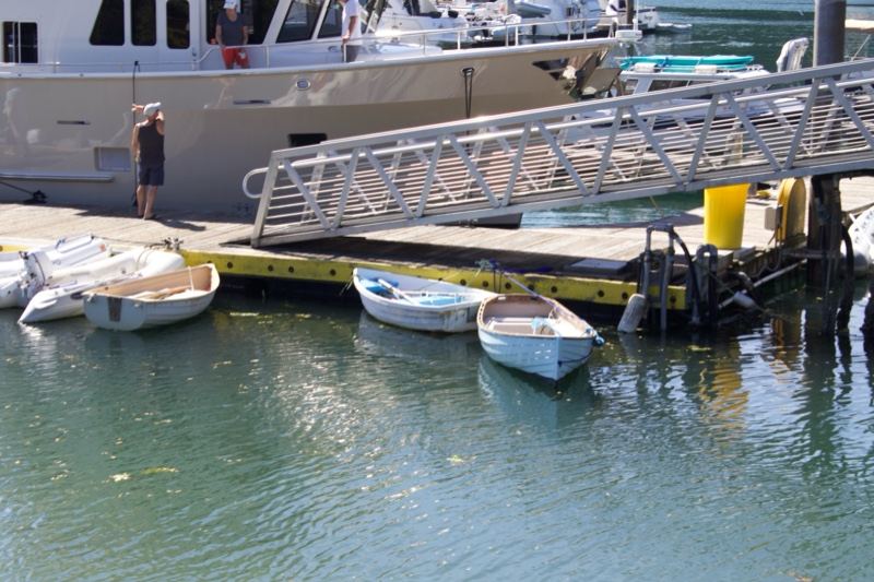 Marina Dock with Small Boats and Yacht