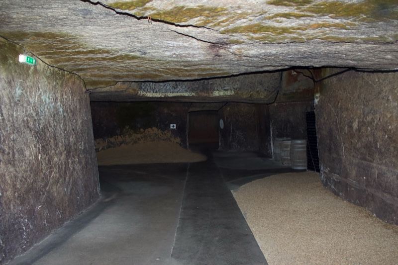 Underground stone tunnel with sand floor