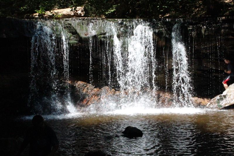Tropical Waterfall Cascading Into Pool