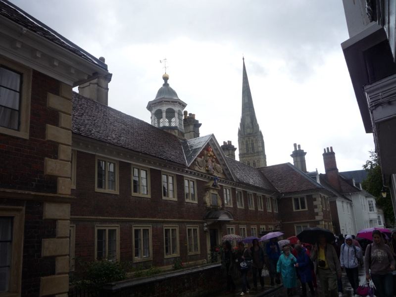 Historic Brick Building With Spire Under Rain