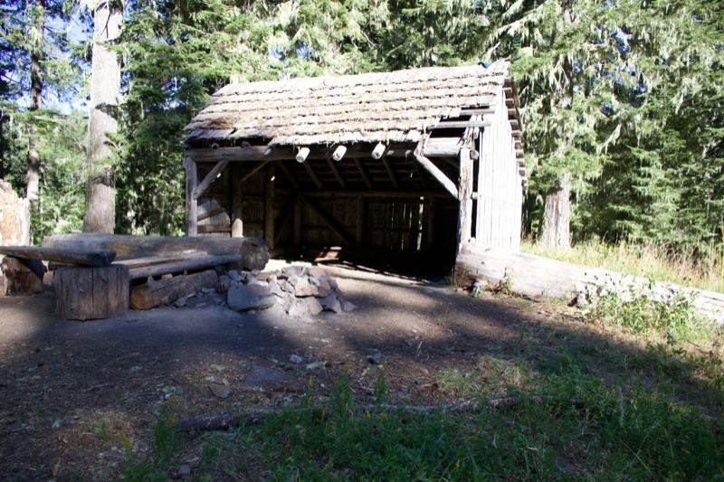 Rustic Wooden Shelter In Forest