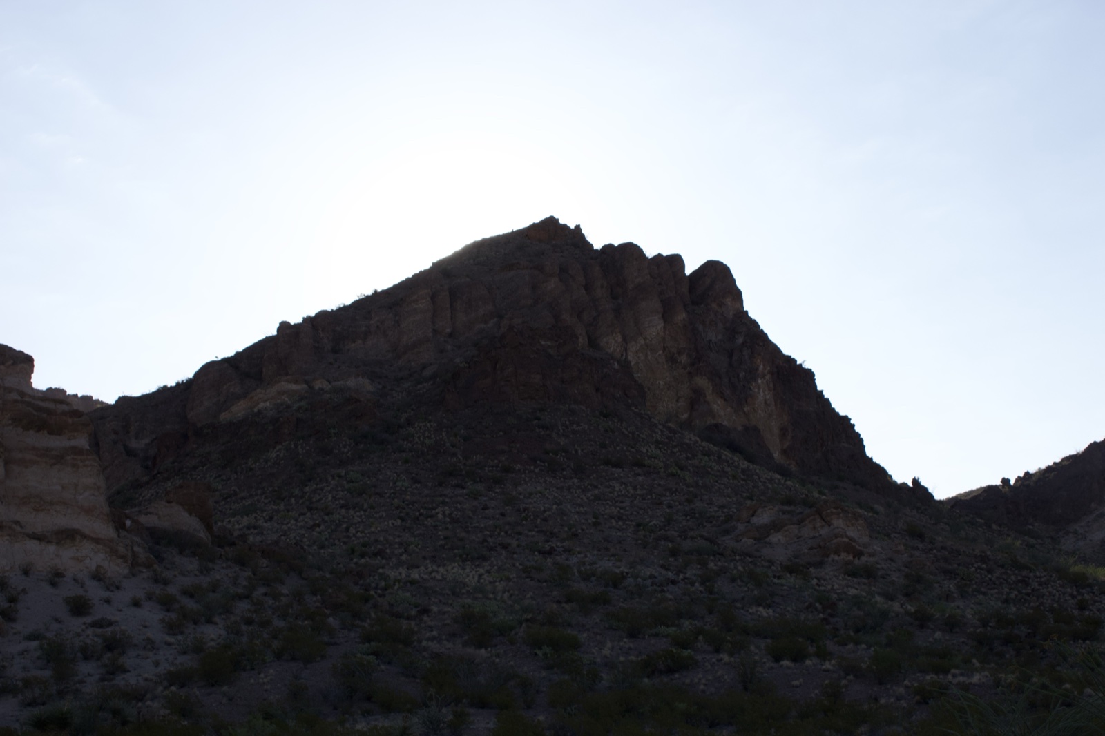 Silhouetted Desert Mountain Peak