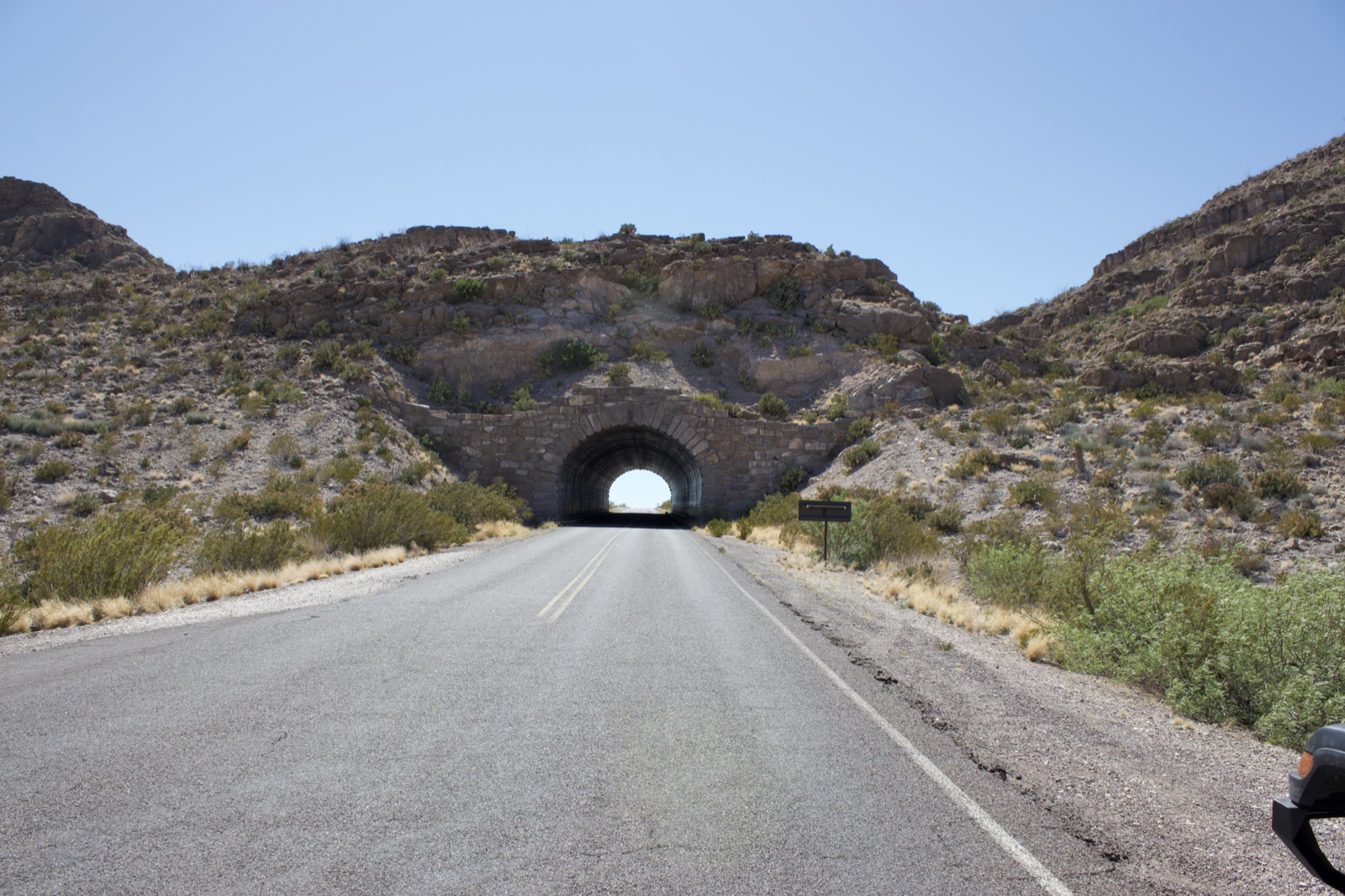Desert Highway Leading to Mountain Tunnel