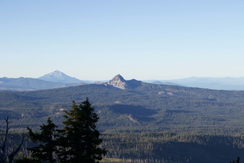 Mountain Peak Over Forested Valley