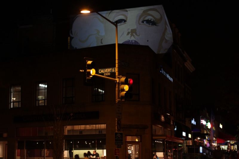 Projected Face on Building at Night