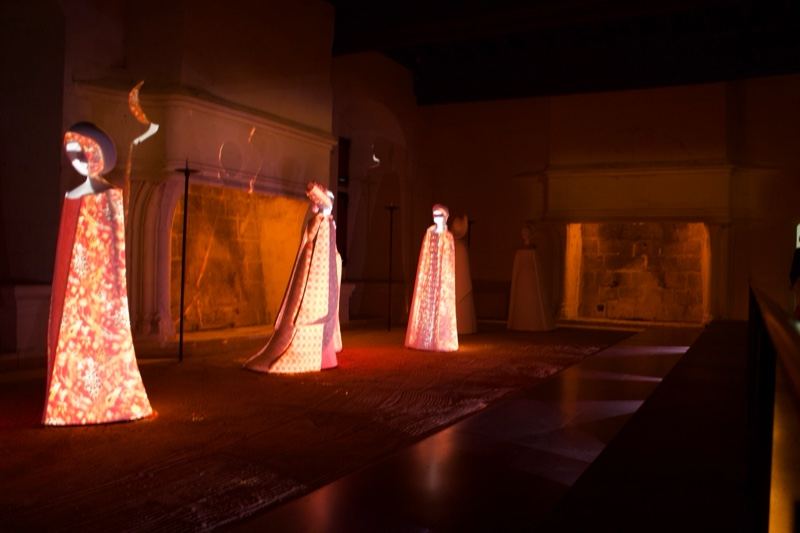 Illuminated Robed Figures in Gallery