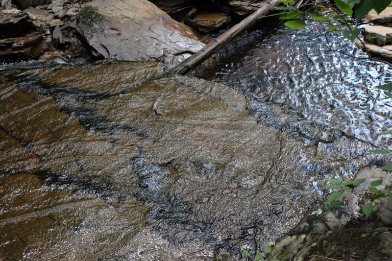 Wet Rock With Flowing Stream Water