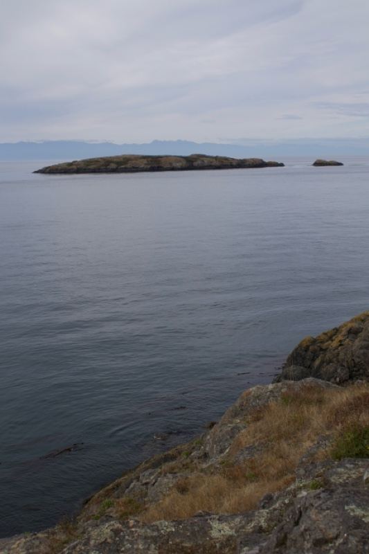 Distant Island Over Calm Sea