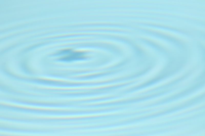 Concentric Ripples on Light Blue Water