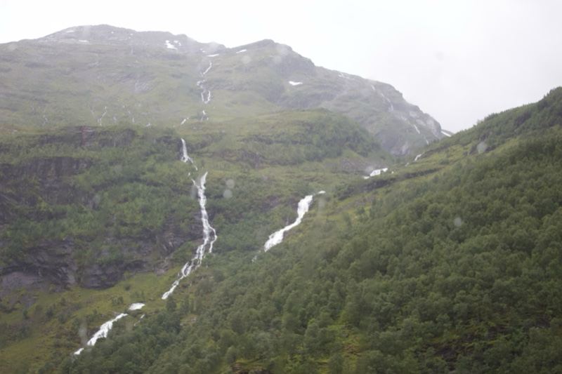 Mountain Waterfalls in Misty Green Valley