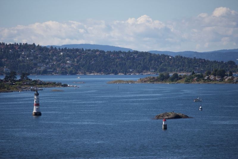Coastal Waterway With Lighthouse And Islands