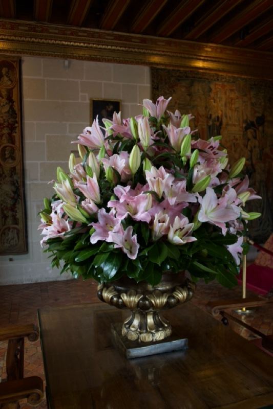 Pink Lilies in Ornate Urn Indoors