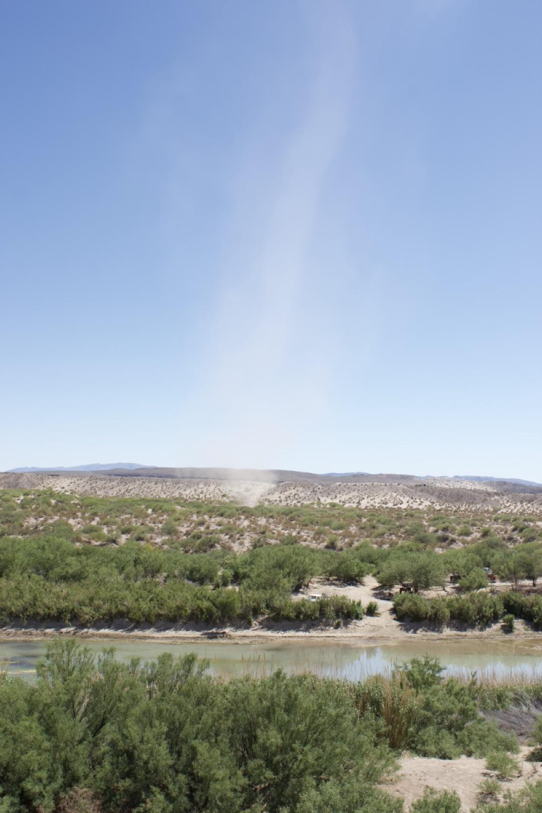 Dust Devil Over Desert River