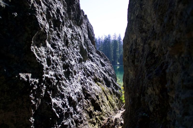 Narrow Rock Fissure With Forest Beyond