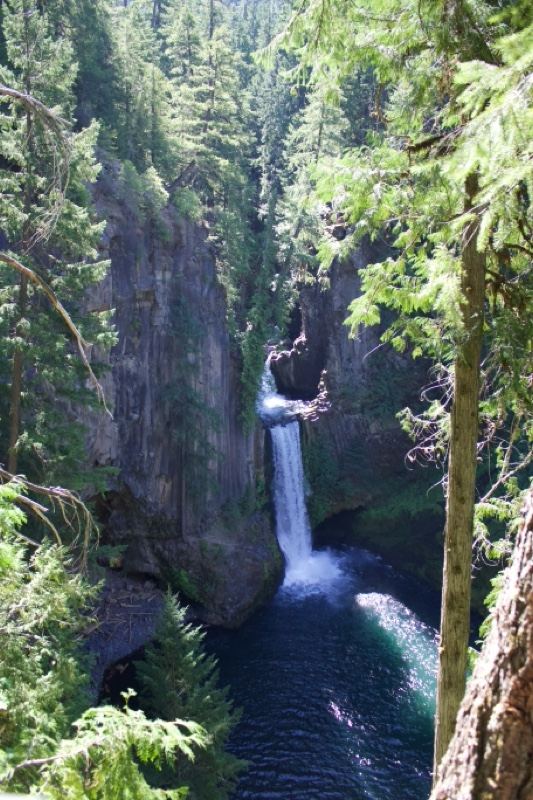 Waterfall Cascading Into Deep Gorge Pool