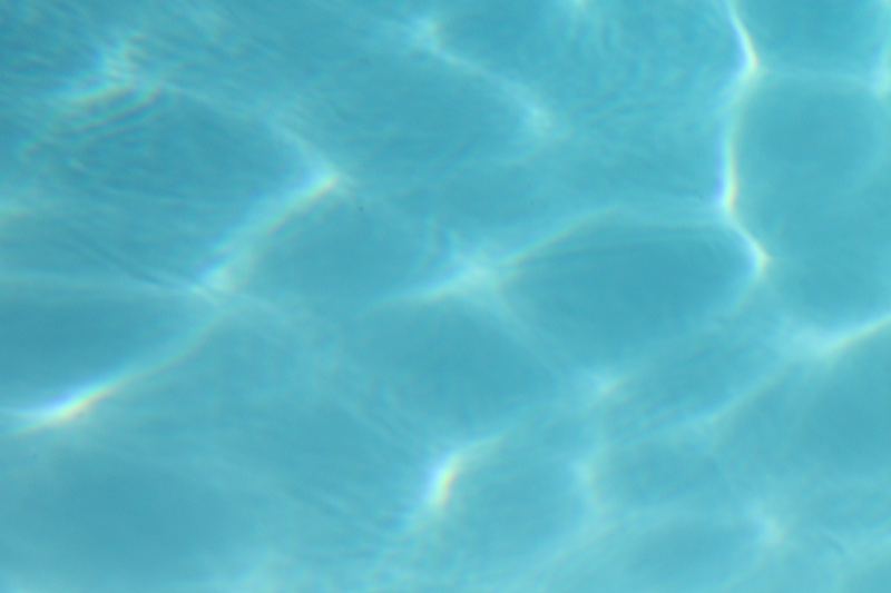 Sunlit Pool Water Ripples