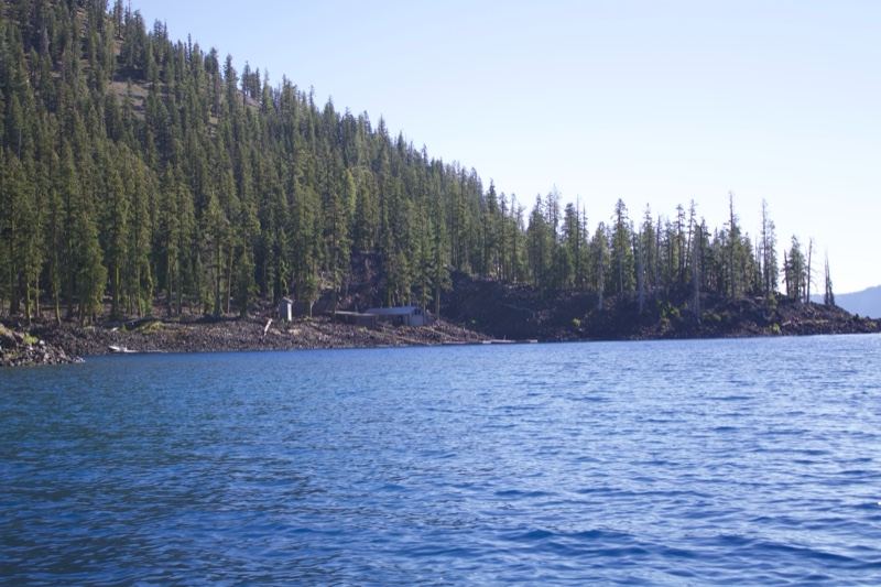Forested Shore on Calm Alpine Lake